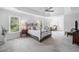 Serene main bedroom with plush carpeting, tray ceiling, ample windows, and a comfortable bed at 200 Glen Wood Place, Canton, GA 30114