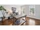 Inviting home office featuring a modern desk setup, hardwood floors, and ample natural light at 200 Glen Wood Place, Canton, GA 30114