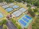 Aerial view of several community tennis courts offering residents a variety of recreational options at 200 Glen Wood Place, Canton, GA 30114