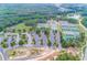 Aerial view of a tennis court complex surrounded by lush green trees and a parking lot for convenience at 200 Glen Wood Place, Canton, GA 30114