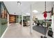 Spacious basement with a workout area, comfortable seating, stylish decor, and ample lighting for various activities at 2653 W Main Nw St, Atlanta, GA 30318