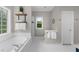 Bright bathroom with a garden tub, privacy windows and linen storage at 2653 W Main Nw St, Atlanta, GA 30318
