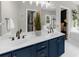 A luxurious bathroom with double vanities, large mirrors, and access to walk-in closet at 2653 W Main Nw St, Atlanta, GA 30318