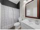 Well-lit bathroom with a shower/tub combo, neutral color palette, and updated fixtures for a fresh and clean aesthetic at 2653 W Main Nw St, Atlanta, GA 30318