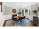 Elegant dining room with bay windows, modern lighting, and stylish decor at 2653 W Main Nw St, Atlanta, GA 30318