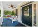 Charming front porch featuring a porch swing and elegant glass paneled front door at 2653 W Main Nw St, Atlanta, GA 30318