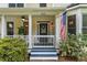 Charming home's front porch featuring a well-maintained garden and inviting entryway at 2653 W Main Nw St, Atlanta, GA 30318