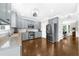 Well-equipped kitchen with gray cabinets, stainless steel appliances, and hardwood floors at 2653 W Main Nw St, Atlanta, GA 30318