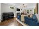 Bright living room with fireplace, flat screen tv, and lots of windows to provide natural light at 2653 W Main Nw St, Atlanta, GA 30318