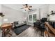 Bright office area with desk, chair, futon, shelves, ceiling fan, natural light, and neutral colors for a productive workspace at 2653 W Main Nw St, Atlanta, GA 30318