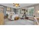 Cozy bedroom featuring a ceiling fan, and work space with lots of natural light at 289 Westland Sw Way, Marietta, GA 30064