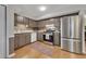 Modern kitchen with stainless steel appliances, wooden cabinets, and hardwood floors at 289 Westland Sw Way, Marietta, GA 30064