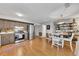 Open concept kitchen with adjacent eat-in dining area with laminate floors, stainless steel appliances and grey cabinetry at 289 Westland Sw Way, Marietta, GA 30064