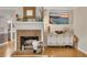 Bright living room with a brick fireplace, modern decor, and hardwood floors at 289 Westland Sw Way, Marietta, GA 30064