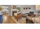 Open living room featuring a fireplace, plush seating, and an open view to the dining area at 289 Westland Sw Way, Marietta, GA 30064