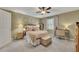 Relaxing main bedroom featuring light green walls, neutral carpet, and comfortable furnishings creates a serene retreat at 289 Westland Sw Way, Marietta, GA 30064