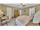This main bedroom with olive green walls has a dresser, a walk in closet and light colored carpet at 289 Westland Sw Way, Marietta, GA 30064