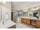 Well-lit bathroom with a walk-in shower, double vanity, and modern fixtures at 4046 Newhaven Ne Cir, Atlanta, GA 30319
