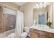 Cozy bathroom with a shower-tub combo, vanity with sink, and tiled walls at 4046 Newhaven Ne Cir, Atlanta, GA 30319