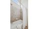 Bathroom featuring a white tub and shower with decorative tile and a white shower curtain at 4046 Newhaven Ne Cir, Atlanta, GA 30319