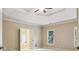 Spacious bedroom featuring plush carpet, neutral colors, and ample natural light from the window at 4046 Newhaven Ne Cir, Atlanta, GA 30319