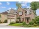 Charming two-story brick home with a well-manicured lawn, two-car garage, and a inviting front entrance at 4046 Newhaven Ne Cir, Atlanta, GA 30319