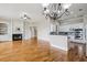Open-concept space with living area fireplace flows into kitchen, featuring sleek appliances and hardwood floors at 4046 Newhaven Ne Cir, Atlanta, GA 30319