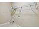 Laundry room with utility shelf and hook rack ready for appliances at 4046 Newhaven Ne Cir, Atlanta, GA 30319