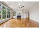 Sunlit living room boasting a fireplace, built-in shelving, and large windows at 4046 Newhaven Ne Cir, Atlanta, GA 30319