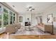 Bright living room with hardwood floors, large windows, and a fireplace at 4046 Newhaven Ne Cir, Atlanta, GA 30319