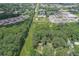 Property aerial view highlighting proximity to nearby shopping and businesses, surrounded by lush trees and landscaping at 539 Karen Dr, Alpharetta, GA 30009