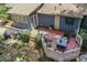 Aerial view of outdoor deck area with furniture and wooded backyard with garden at 539 Karen Dr, Alpharetta, GA 30009