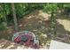 Aerial view of outdoor deck area with furniture in private, wooded backyard at 539 Karen Dr, Alpharetta, GA 30009