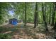 A view of the backyard showcasing its size and privacy due to surrounding trees at 539 Karen Dr, Alpharetta, GA 30009