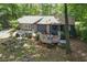 Backyard view showing the deck and garden beds, attached to the home's rear at 539 Karen Dr, Alpharetta, GA 30009