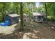 View of back of home with small deck, shed, and wooded back yard offering privacy at 539 Karen Dr, Alpharetta, GA 30009