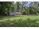 Charming single-story home with blue siding, red shutters, and a lush green lawn at 539 Karen Dr, Alpharetta, GA 30009