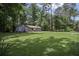 Charming single-story home with blue siding, red shutters, and a lush green lawn at 539 Karen Dr, Alpharetta, GA 30009