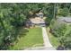 Aerial view showcasing a charming blue home with a well-manicured lawn, inviting curb appeal, and a serene atmosphere at 539 Karen Dr, Alpharetta, GA 30009
