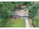 Aerial view showcasing a charming blue home with a well-manicured lawn, an inviting curb appeal, and a serene atmosphere at 539 Karen Dr, Alpharetta, GA 30009