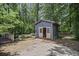 Outbuilding in back of property with double doors, near the wooden deck and yard at 539 Karen Dr, Alpharetta, GA 30009