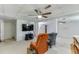 Basement with a ceiling fan, a flat screen television, seating, and a doorway to another room at 711 Belgrave Ln, Tucker, GA 30084