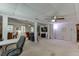 Finished basement with a ceiling fan, desk and workstation, seating area, and bar at 711 Belgrave Ln, Tucker, GA 30084