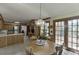 Eat in kitchen includes stainless steel appliances, plenty of oak cabinets, a breakfast nook, and access to a patio at 711 Belgrave Ln, Tucker, GA 30084