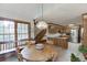 Open kitchen and breakfast nook area, staircase access, wood cabinets, stainless appliances, and plenty of counter space at 711 Belgrave Ln, Tucker, GA 30084