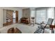 Spacious living room with multiple seating areas and decorative windows at 711 Belgrave Ln, Tucker, GA 30084