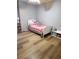 Charming bedroom showcasing neutral walls, a ceiling fan, and a cozy white single bed with cute decor at 102 Ashbury Dr, Villa Rica, GA 30180