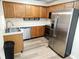 Functional kitchen equipped with stainless steel appliances, wood cabinets, and ample counter space at 102 Ashbury Dr, Villa Rica, GA 30180