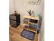 Compact kitchenette includes a mini fridge, microwave, and a charming plant, maximizing space and functionality at 102 Ashbury Dr, Villa Rica, GA 30180