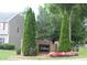 Community entrance sign surrounded by colorful flowers and greenery welcomes residents and visitors at 102 Ashbury Dr, Villa Rica, GA 30180